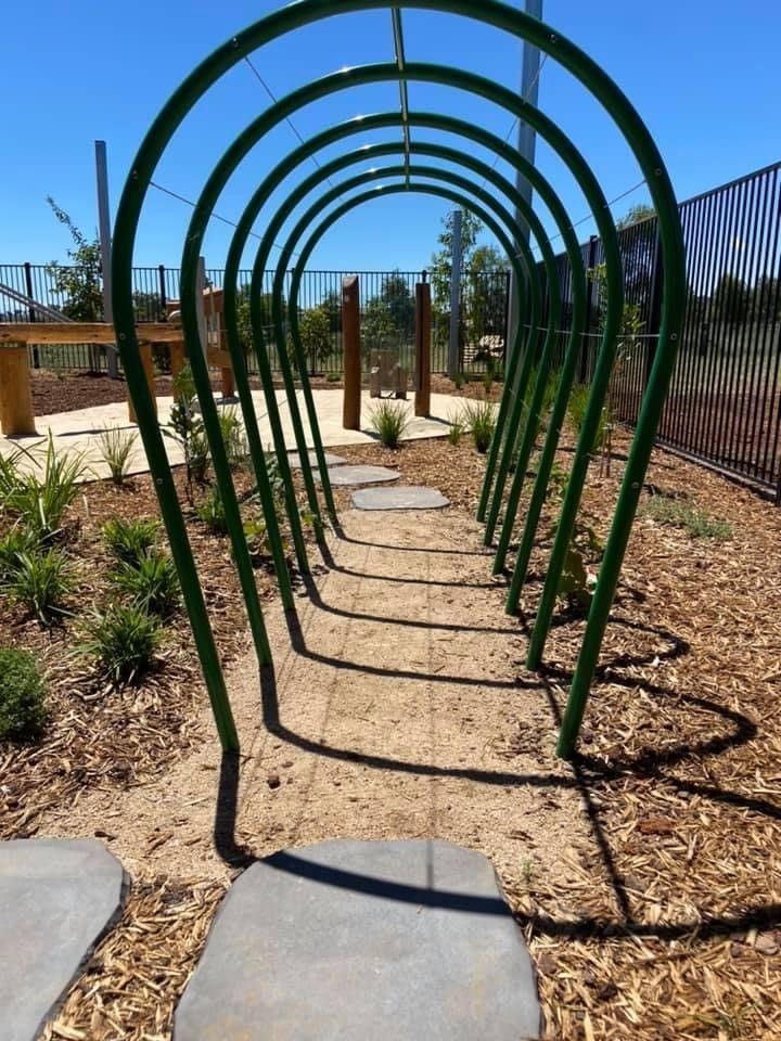 Green Arched Tunnel Structure With Stone Path in a Playground — ATH Projects in Moore Creek, NSW