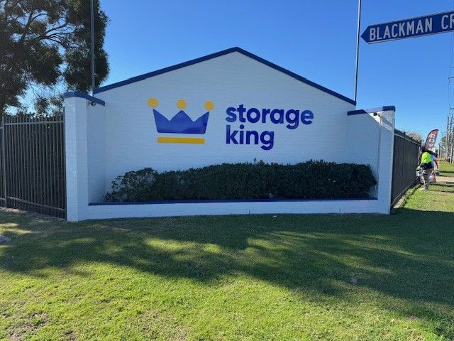 Storage King Entrance With a Blue and Yellow Crown Logo — ATH Projects in Kirrawee, NSW