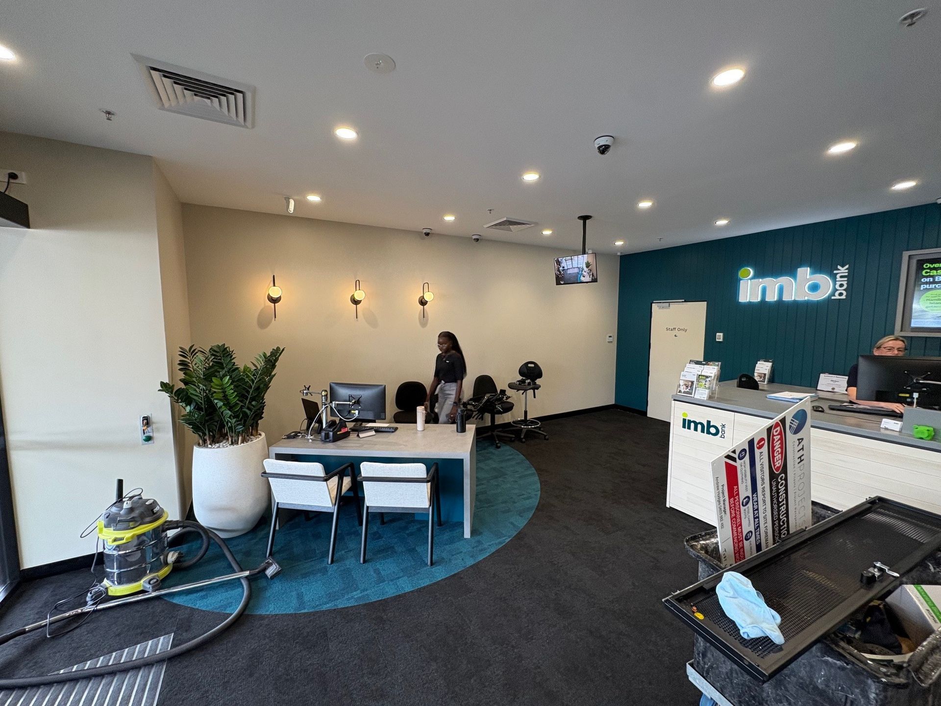 Interior of an Imb Office. A Person Stands Behind a Desk — ATH Projects in Kirrawee, NSW
