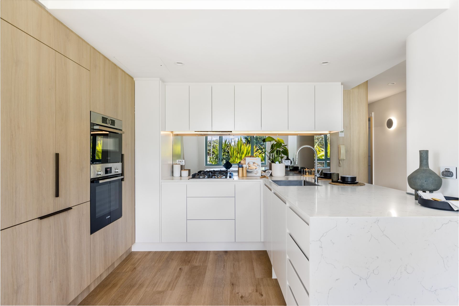 Modern Kitchen With Light Wood Cabinets — ATH Projects in Drummoyne, NSW