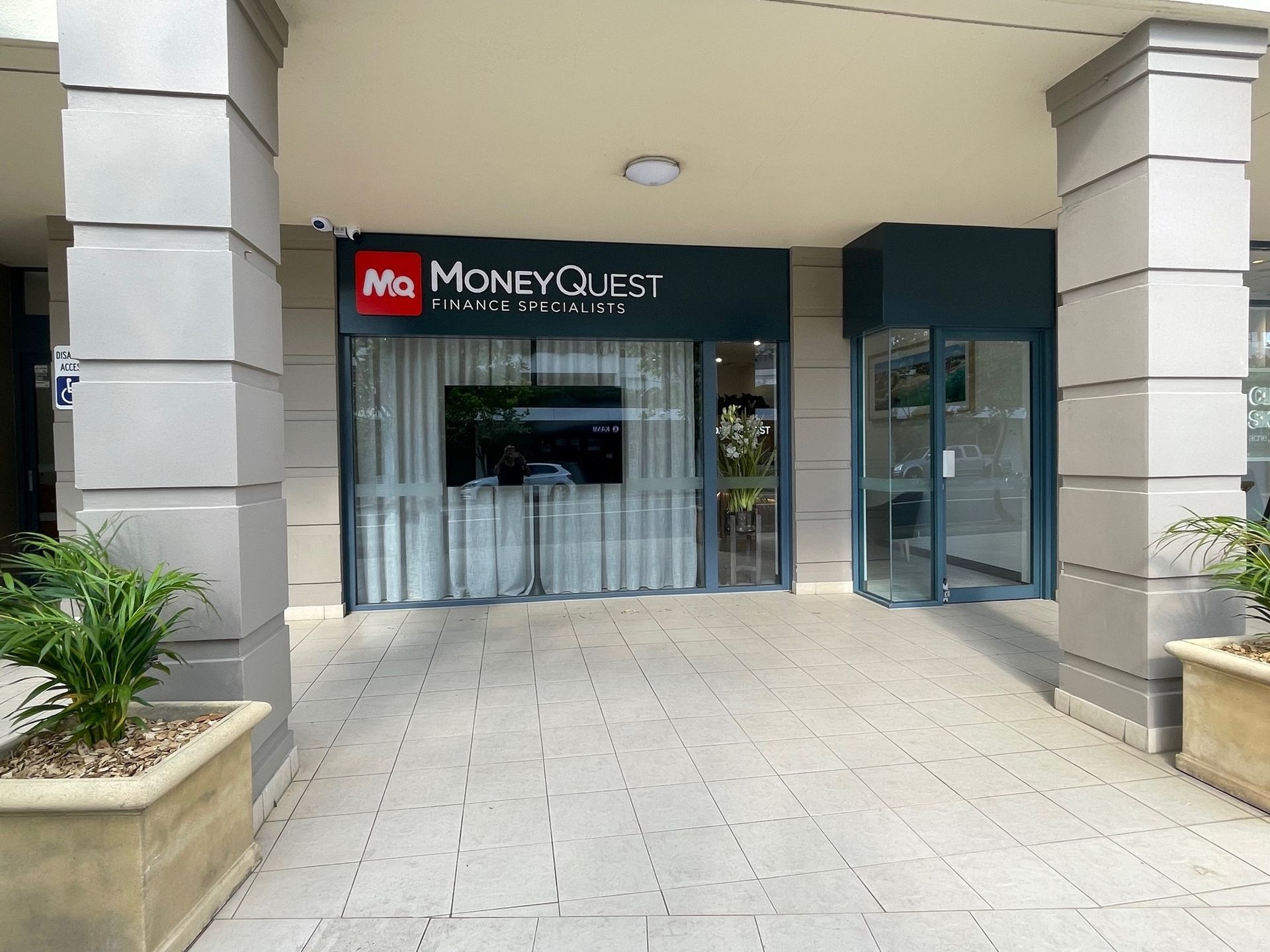 Exterior of a Money Quest Store With Glass Doors — ATH Projects in Kirrawee, NSW