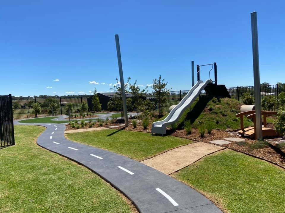 Playground With a Road, Slide, and Grassy Area — ATH Projects in Moore Creek, NSW