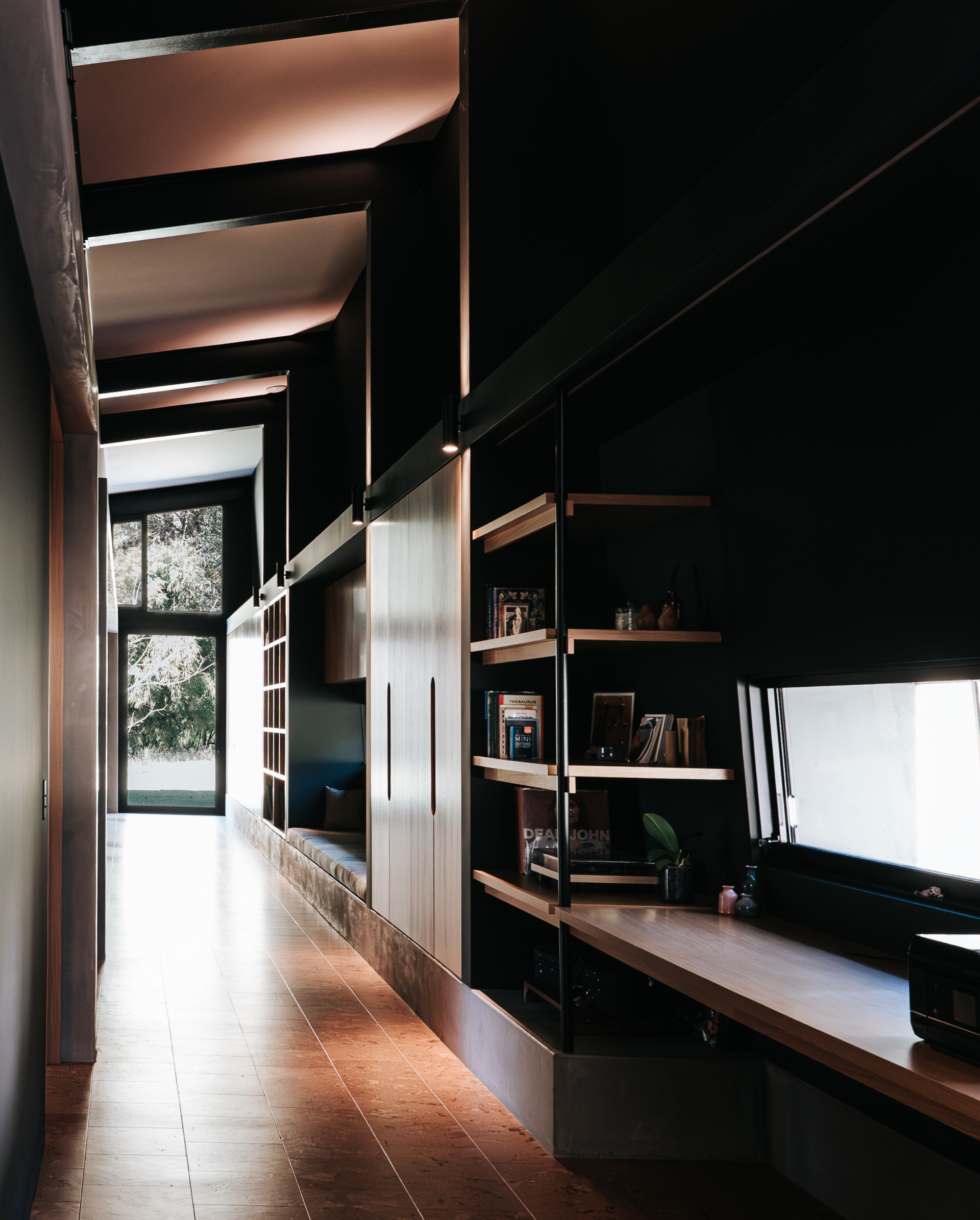 Long Hallway With Built-in Dark Shelving and a Wood Desk — ATH Projects in Eerwah Vale, QLD