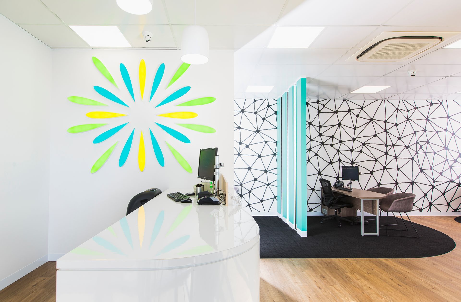 Modern Office Reception Area With Flower-shaped Wall Art — ATH Projects in Kirrawee, NSW