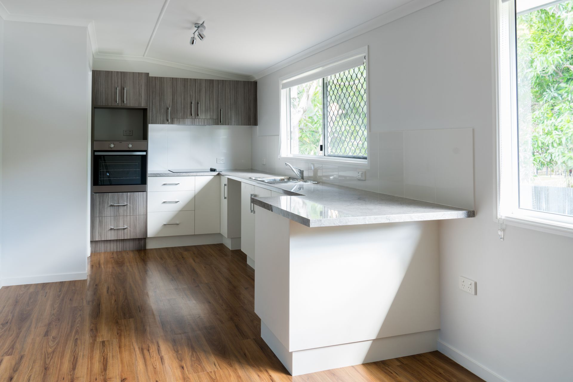 Modern Kitchen With Wooden Flooring in Sydney