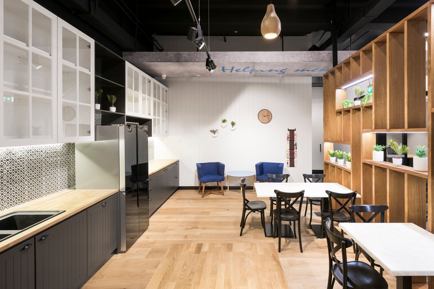Modern Kitchen and Dining Area With Wooden Floor, Cabinets, and Tables — ATH Projects in Kirrawee, NSW