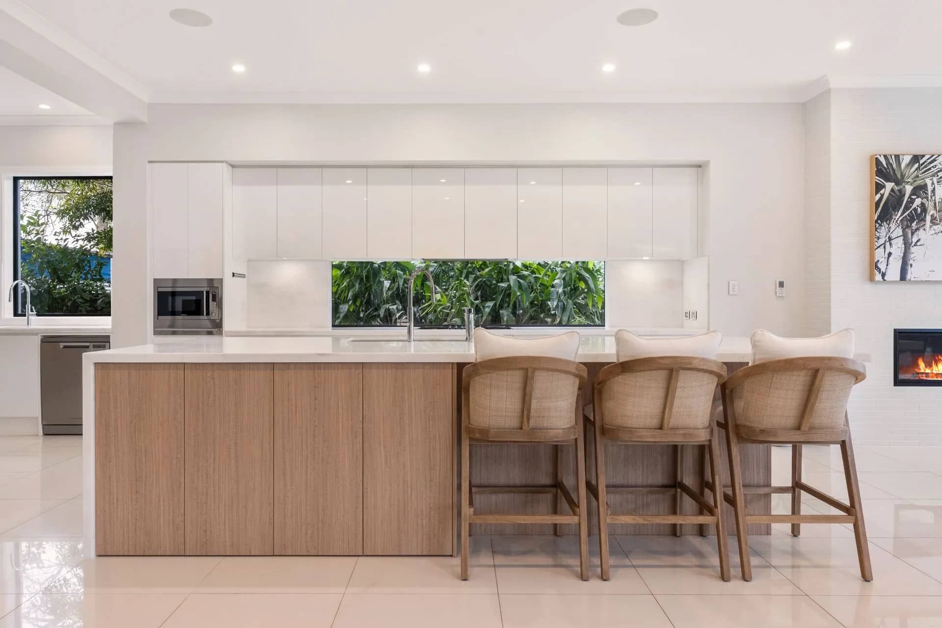 Modern Kitchen With White Cabinets, Light Wood Island, and Three Bar Stools — ATH Projects in Kirrawee, NSW