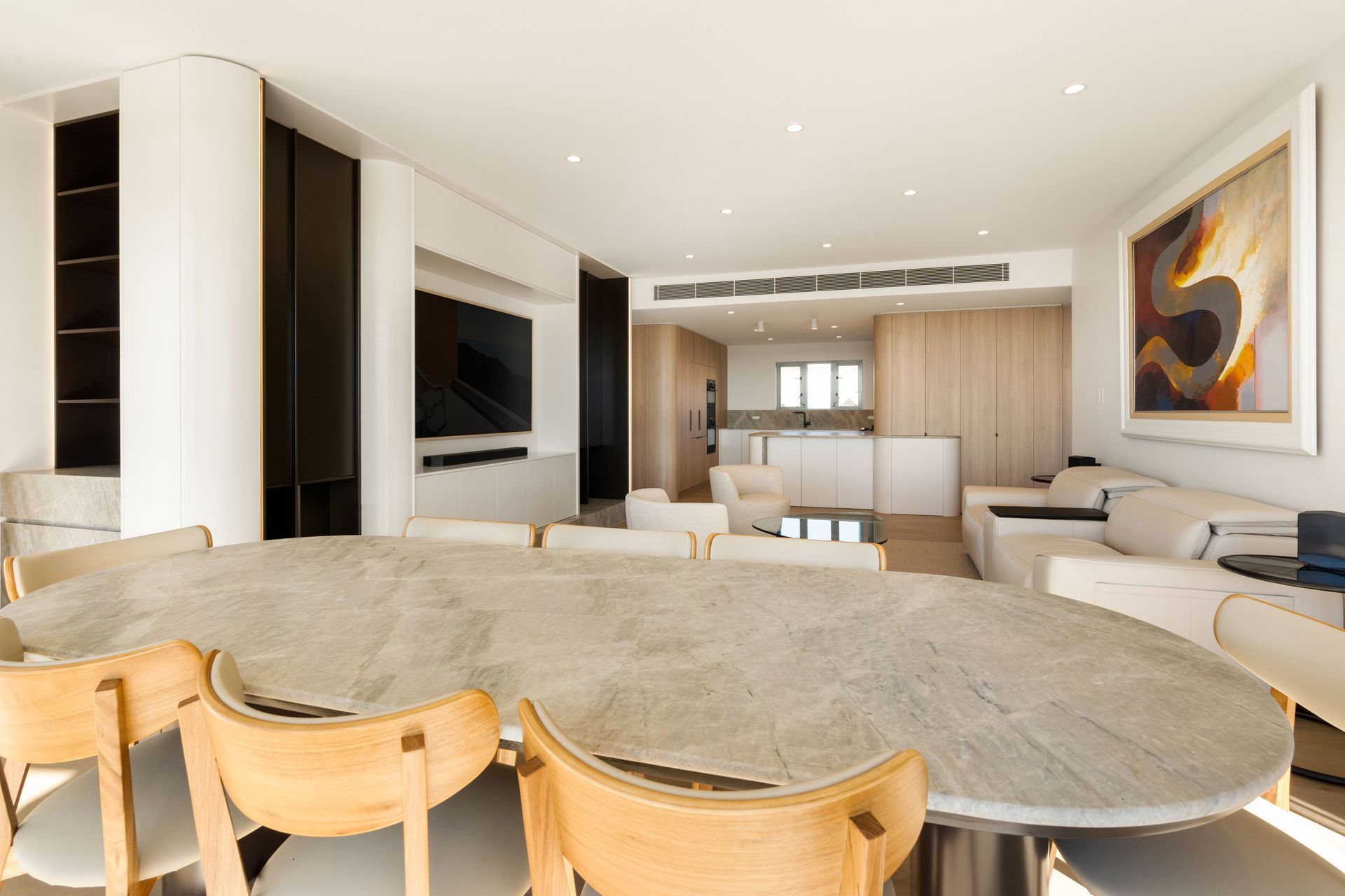 Dining Area With a Large Oval Stone Table and Wooden Chairs — ATH Projects in Drummoyne, NSW