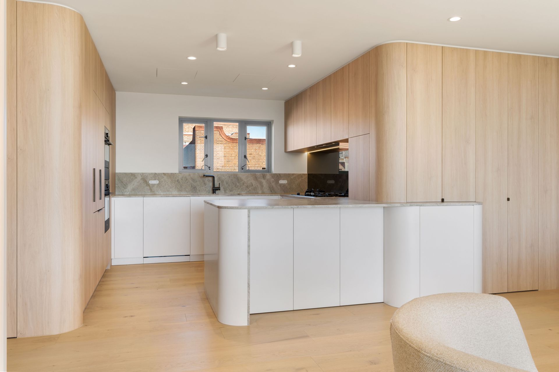 Modern Kitchen With Light Wood Cabinetry and White Island — ATH Projects in Drummoyne, NSW