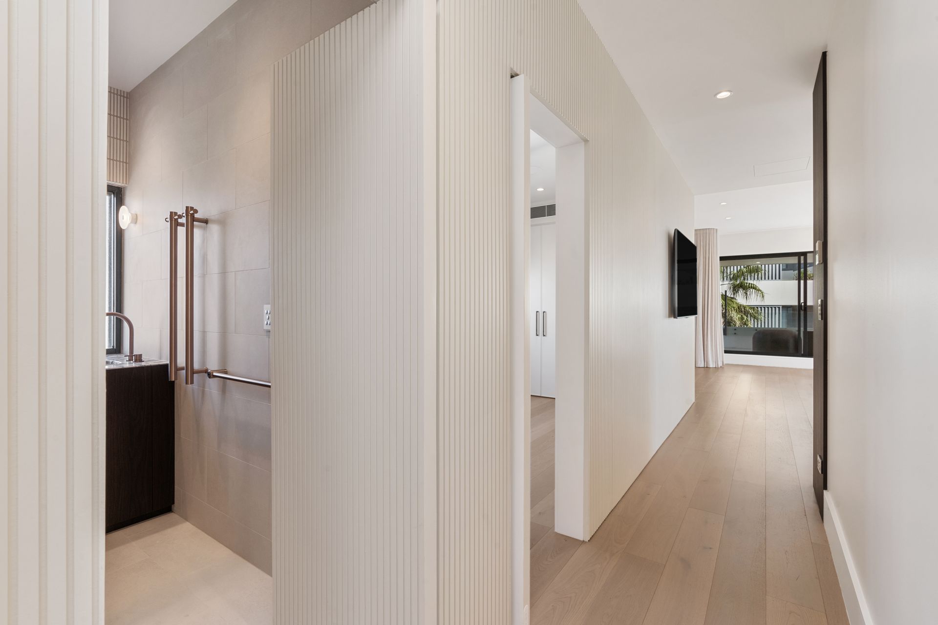 Hallway With Wood Floors, Vertical White Panel Walls — ATH Projects in Cronulla, NSW