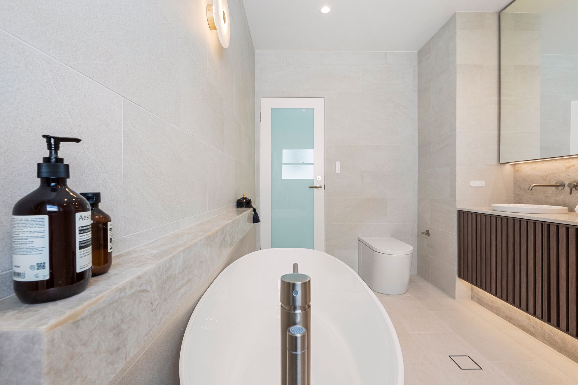 Modern Bathroom With a White Oval Bathtub — ATH Projects in Concord, NSW