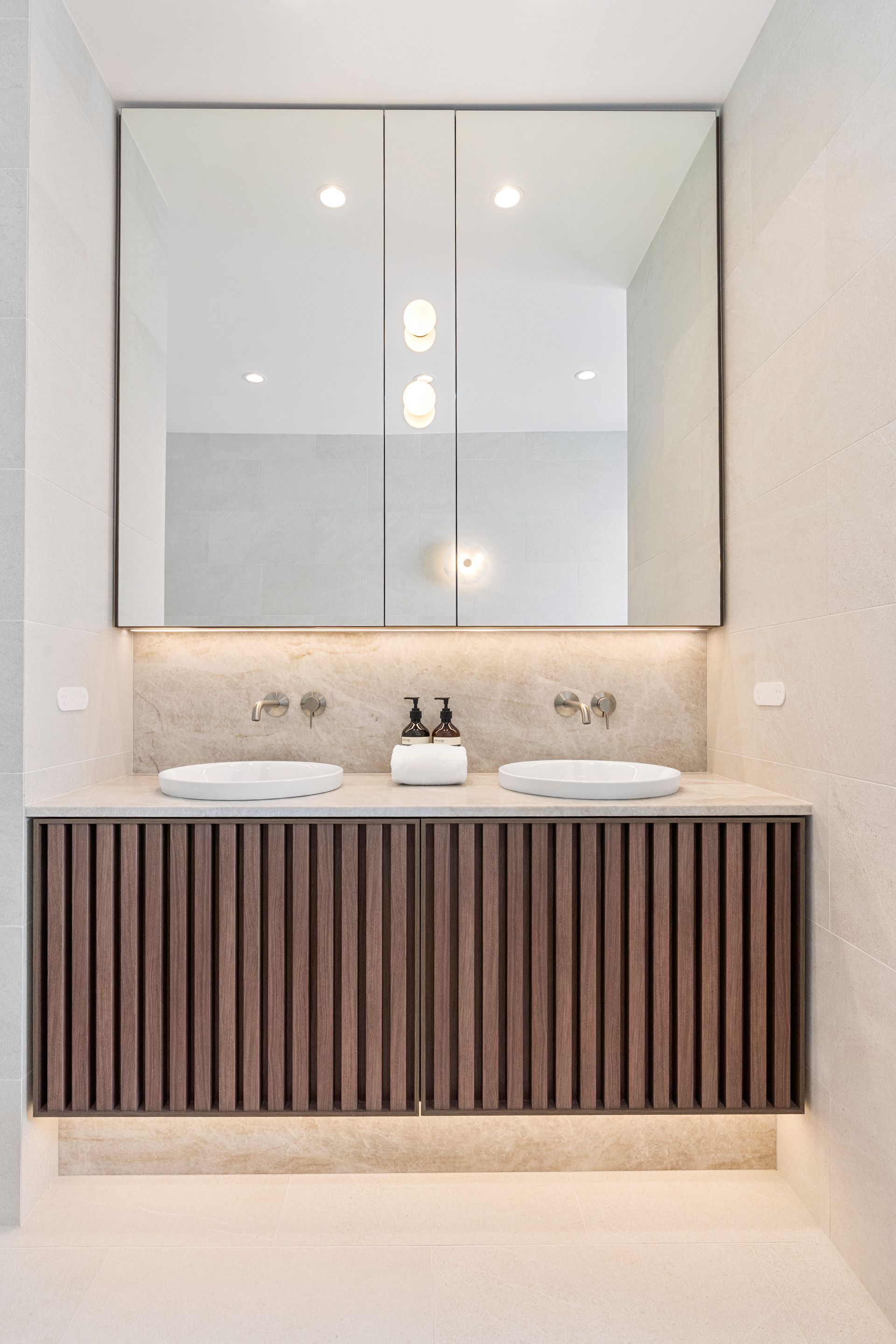 Bathroom With Brown Ribbed Vanity — ATH Projects in Concord, NSW