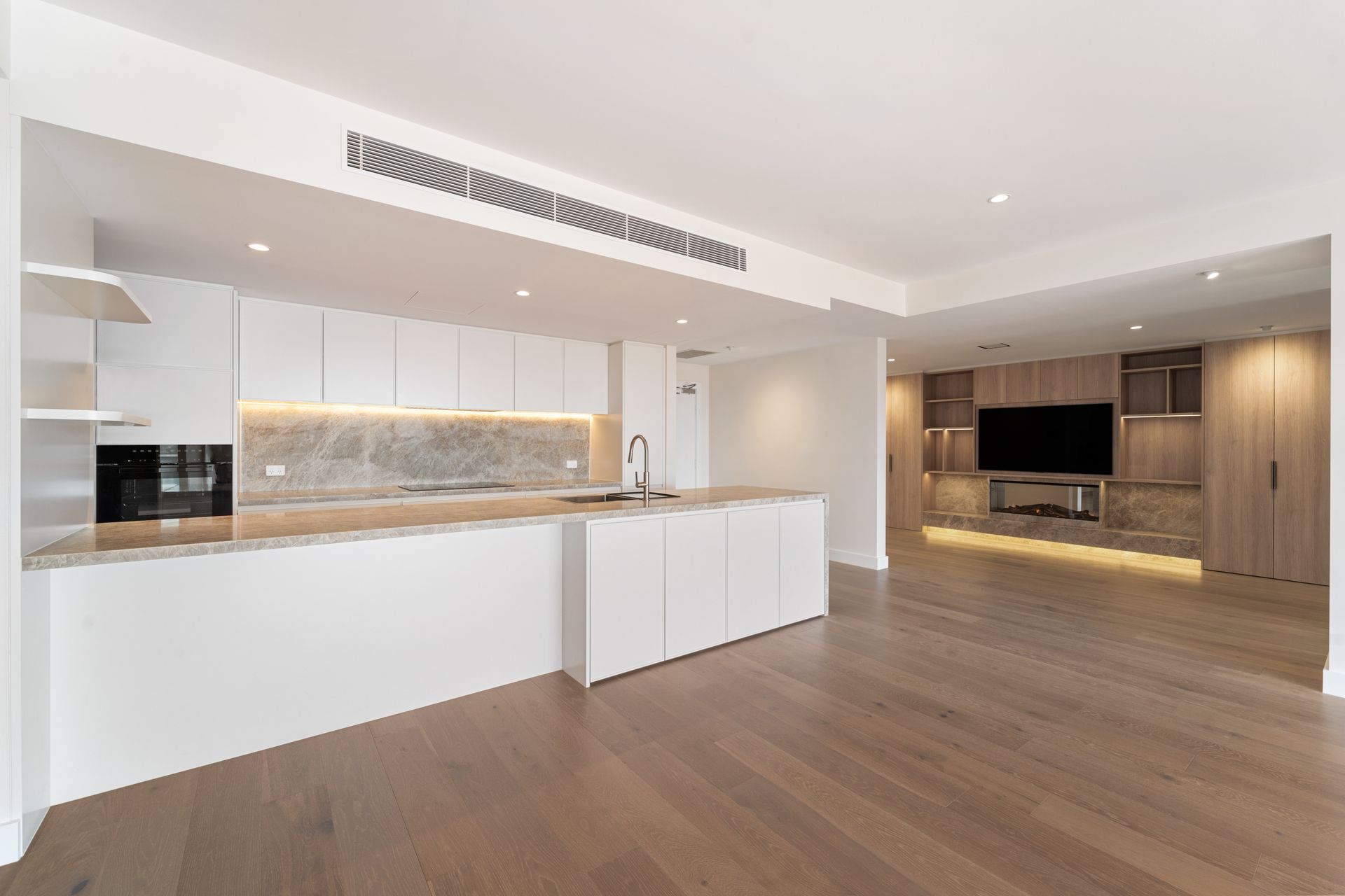 Modern Kitchen and Living Area With White Cabinets — ATH Projects in Rozelle, NSW