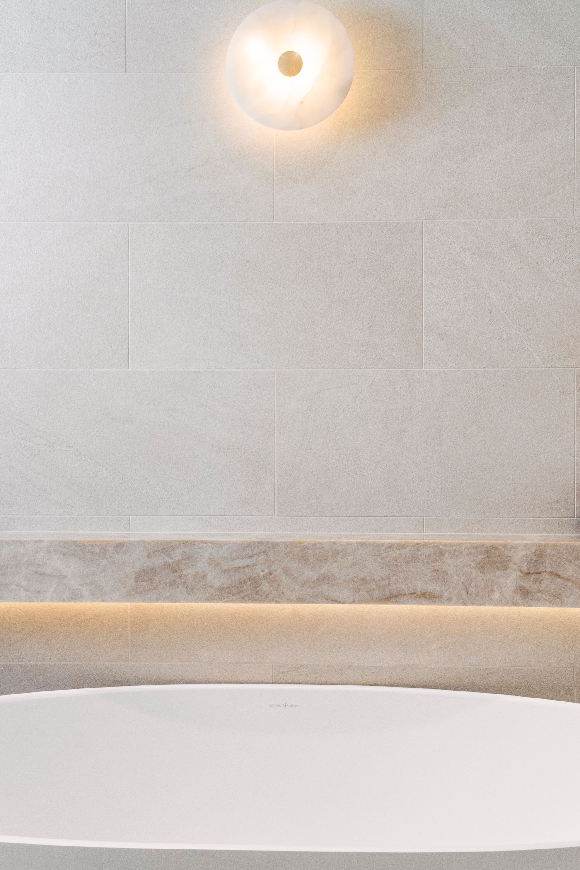 White Bathtub Below Beige Tiled Wall — ATH Projects in Concord, NSW