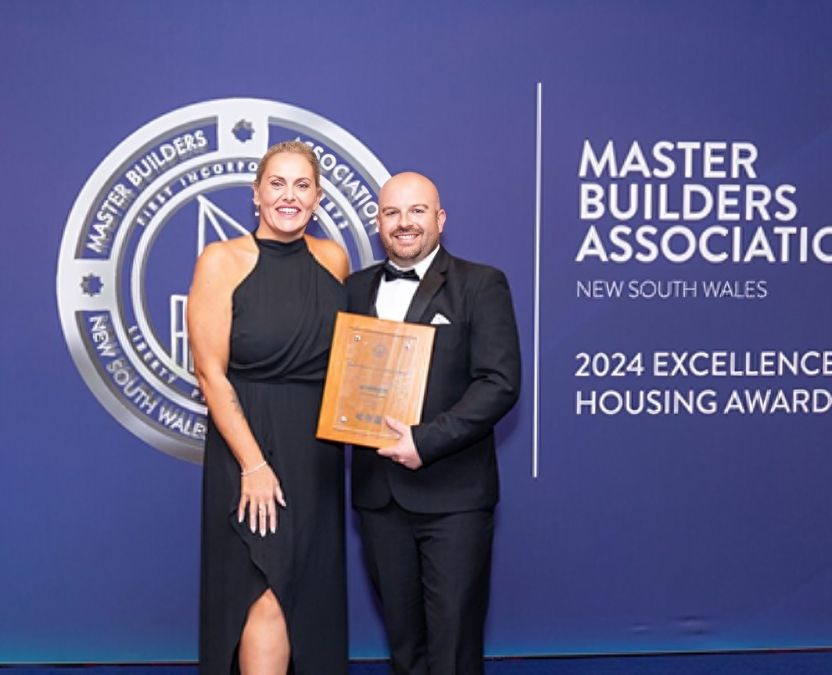 Two People Holding a Plaque at an Awards Ceremony — ATH Projects in Kirrawee, NSW