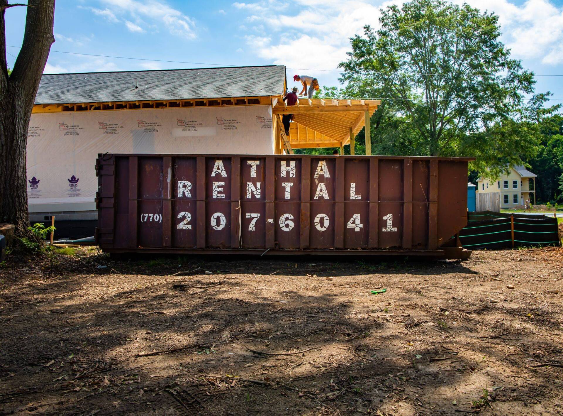A dumpster with the number 207604 on it