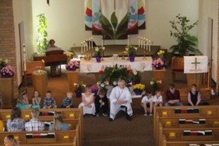 Congregation taking part in service in Spring Prairie