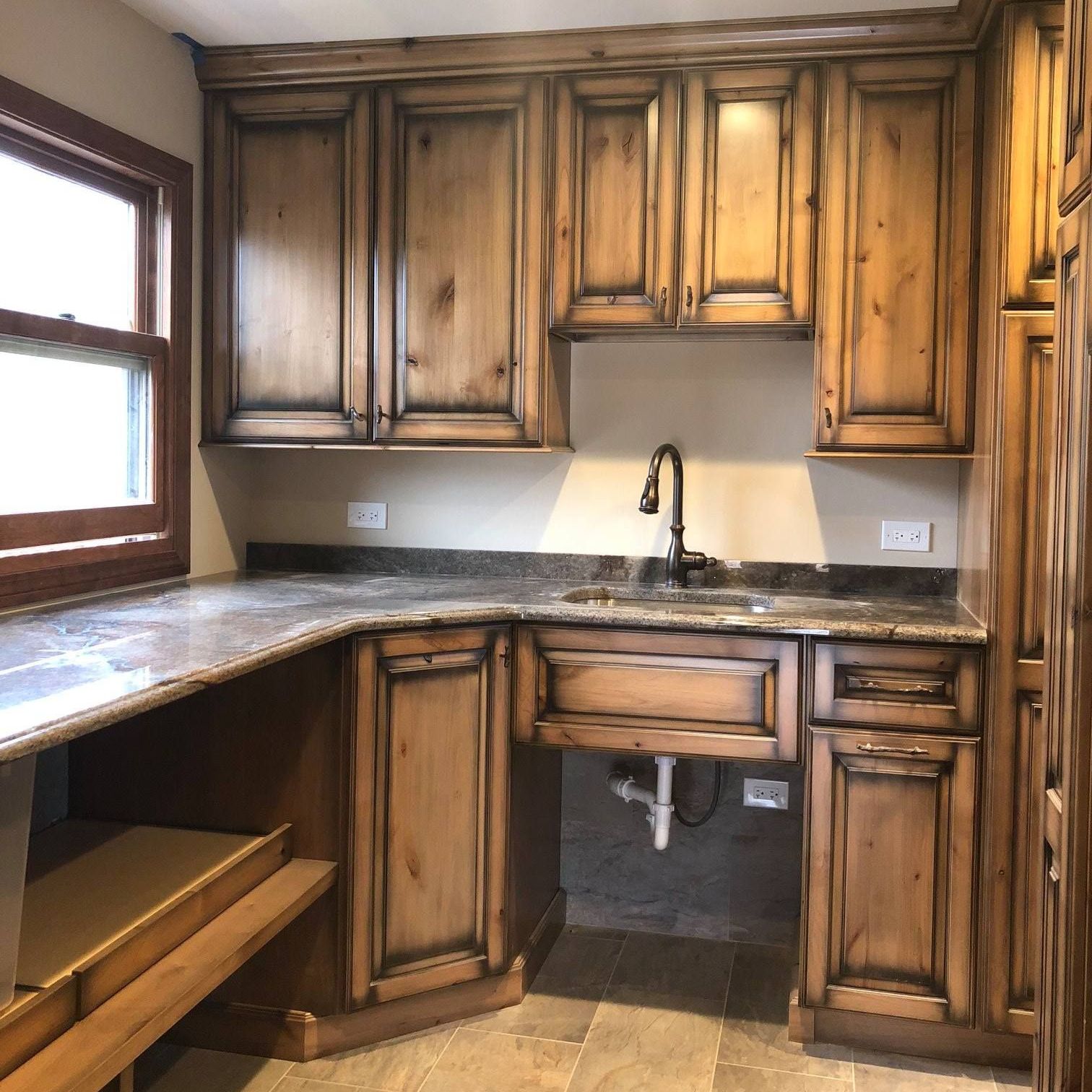 A & R Home Services remodel  kitchen with wooden cabinets and granite counter tops