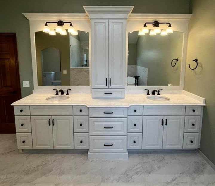 A & R Home Services bathroom with two sinks and a large mirror