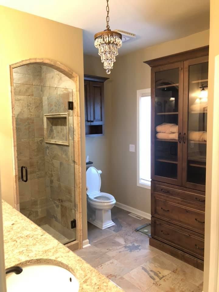 A & R Home Services remodel bathroom with a toilet , sink , and shower.
