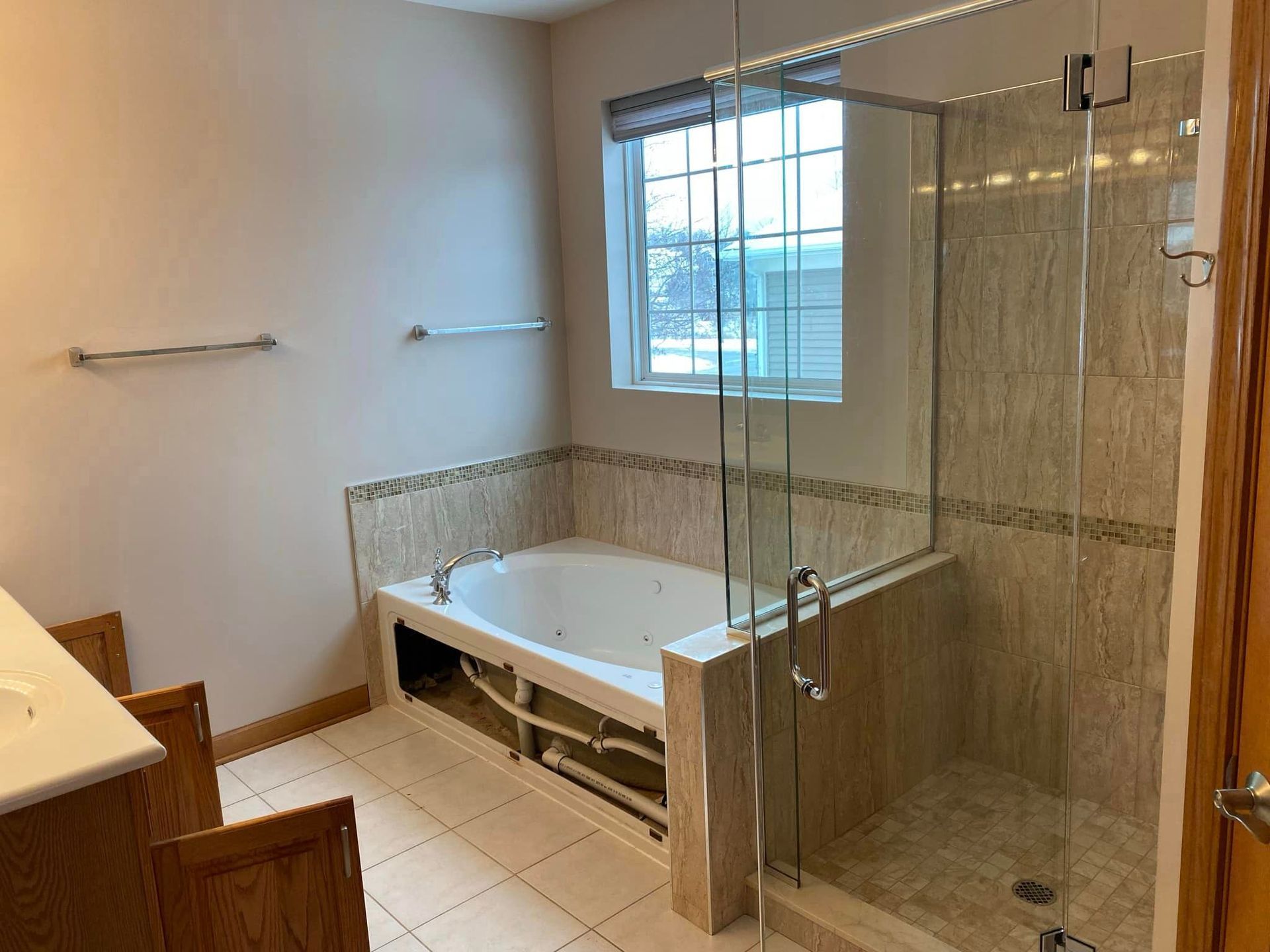 A & R Home Services remodel bathroom with a tub and a walk in shower.