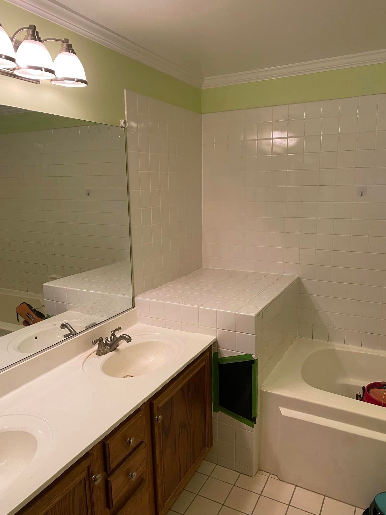 A & R Home Services remodel bathroom with two sinks and a bathtub