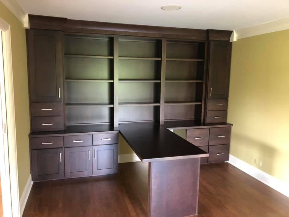 A & R Home Services remodel room with a desk and shelves 