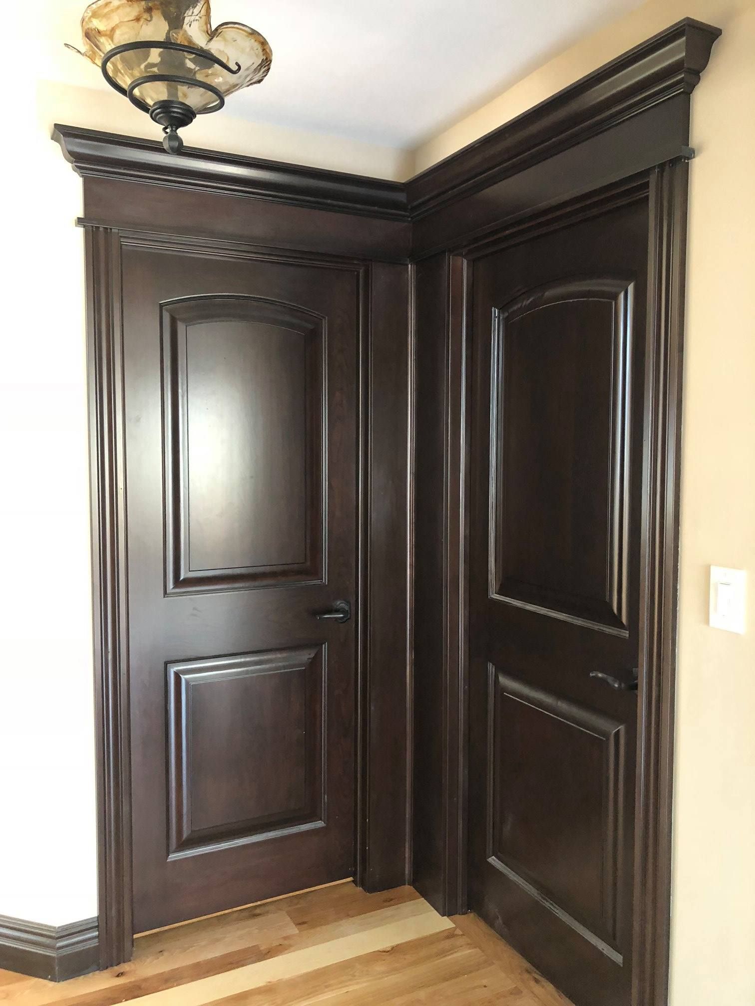 A & R Home Services remodel corner of a room with wooden doors and chandelier 