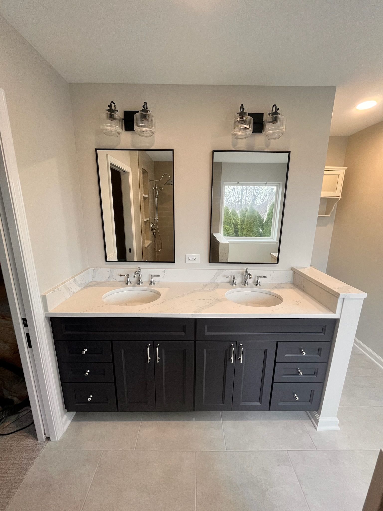 A & R Home Services remodel  bathroom with two sinks and two mirrors.