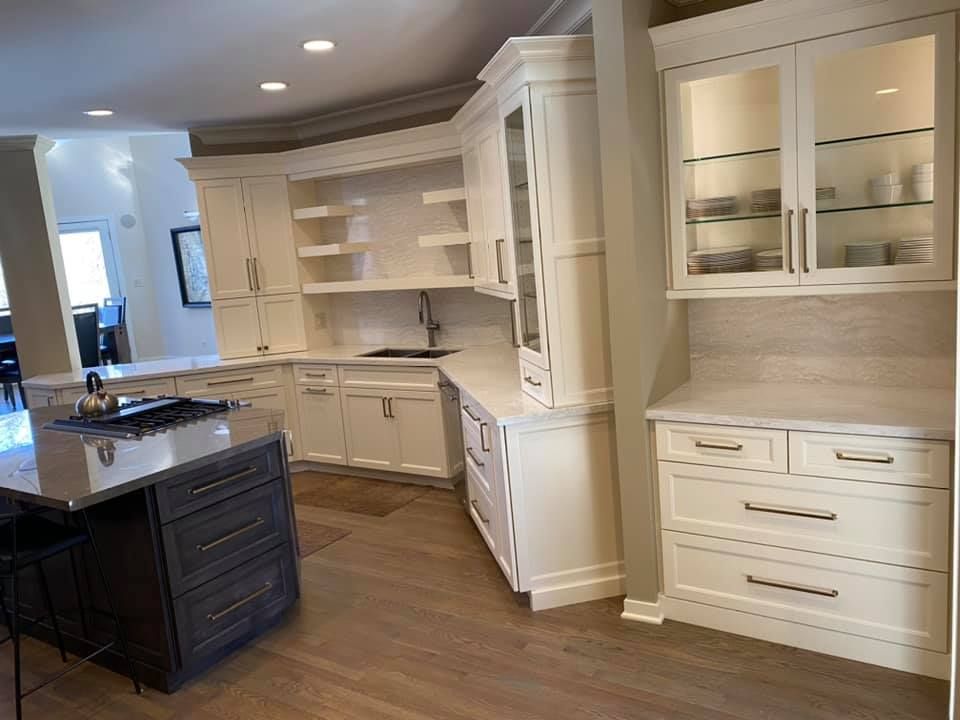 A & R Home Services remodel  kitchen with white cabinets and a large island.