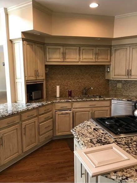 A & R Home Services kitchen with wooden cabinets and granite counter tops