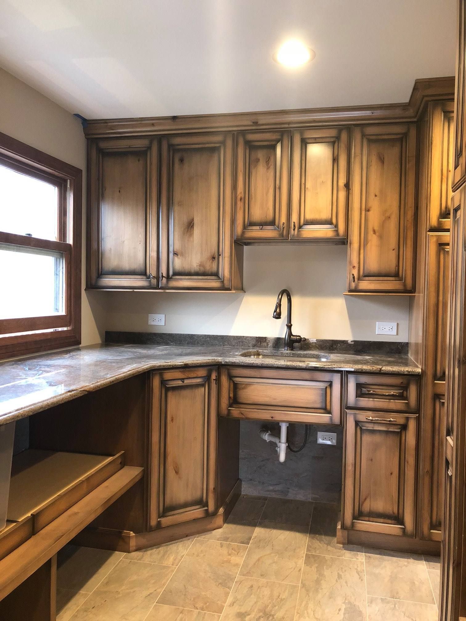 A & R Home Services remodel kitchen with wooden cabinets and granite counter tops