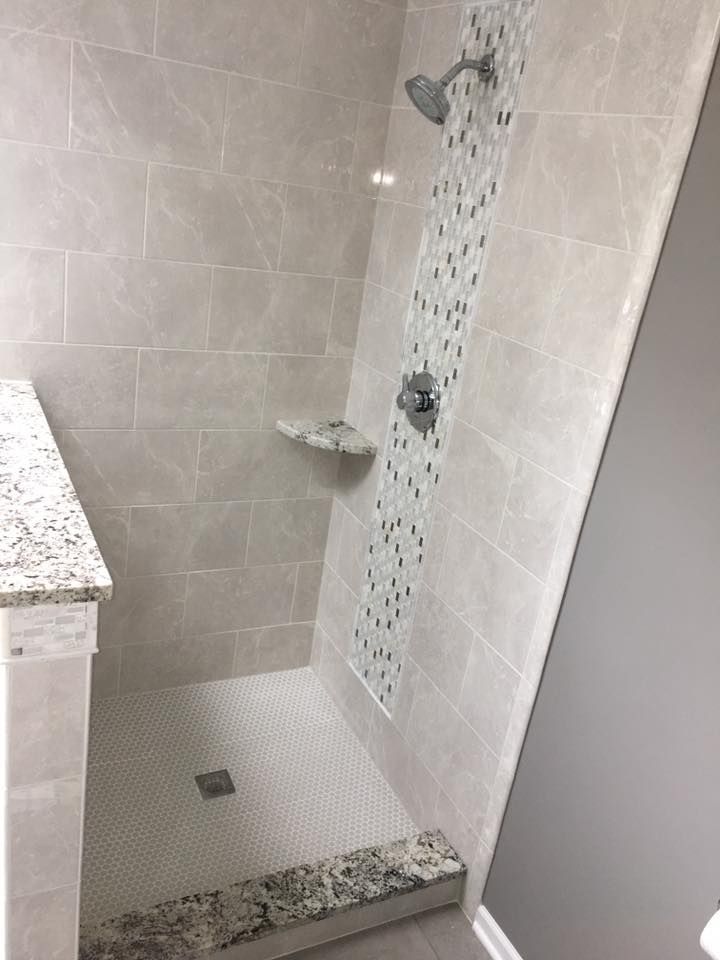 A & R Home Services remodel bathroom with a walk in shower and a sink.