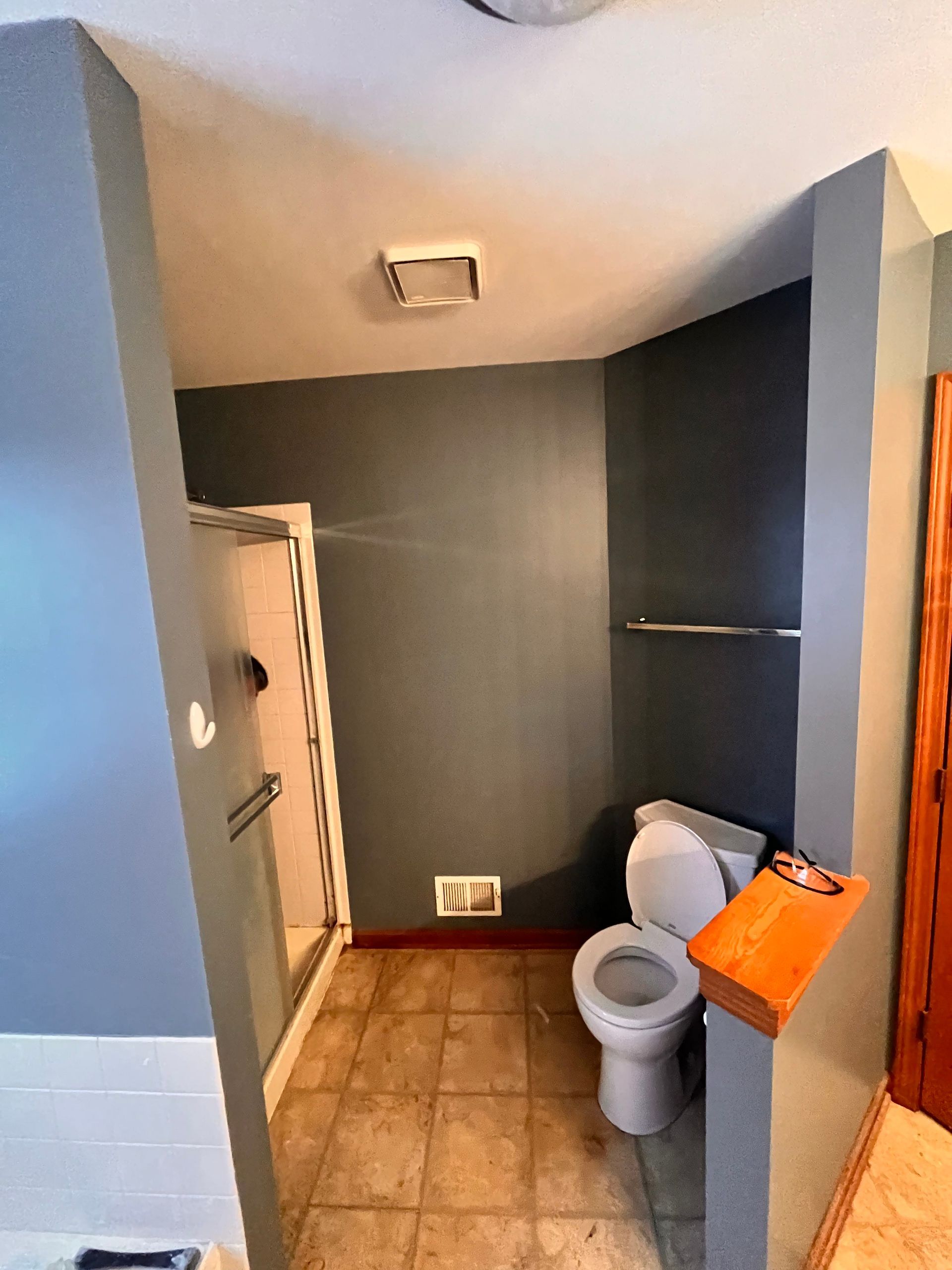 A & R Home Services remodel bathroom with a toilet and a shower stall