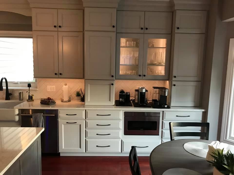 A & R Home Services remodel kitchen with white cabinets and stainless steel appliances