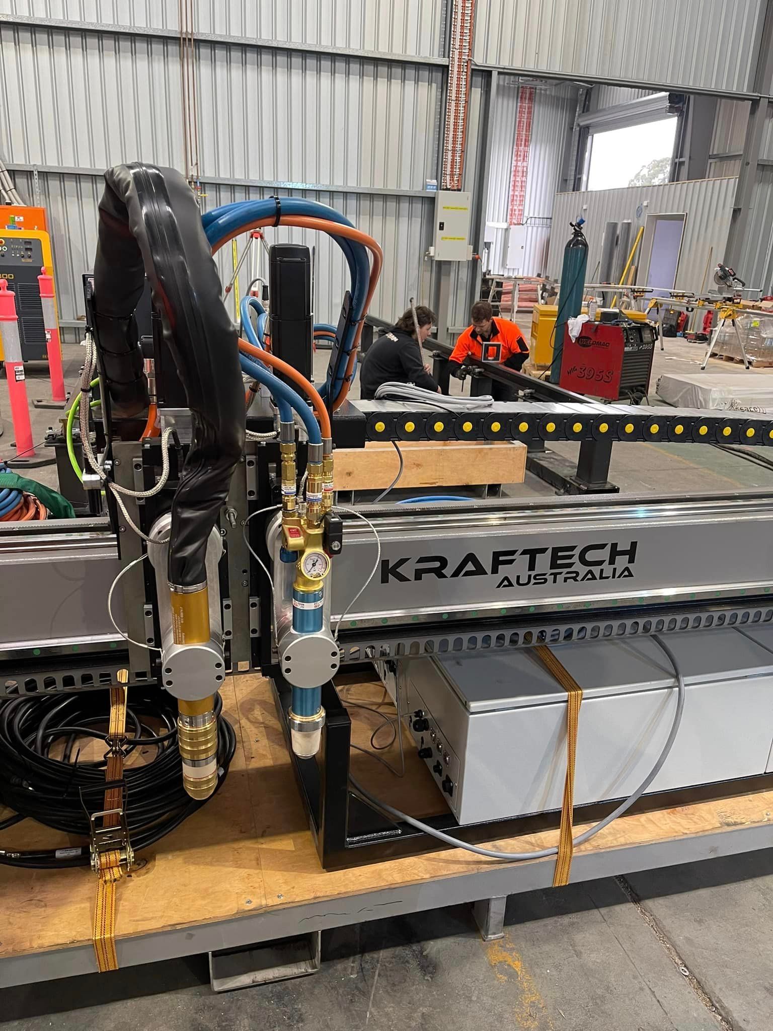 A Machine Is Sitting On Top Of A Wooden Table In A Warehouse – Wacol, QLD - Morgan Metal Corp