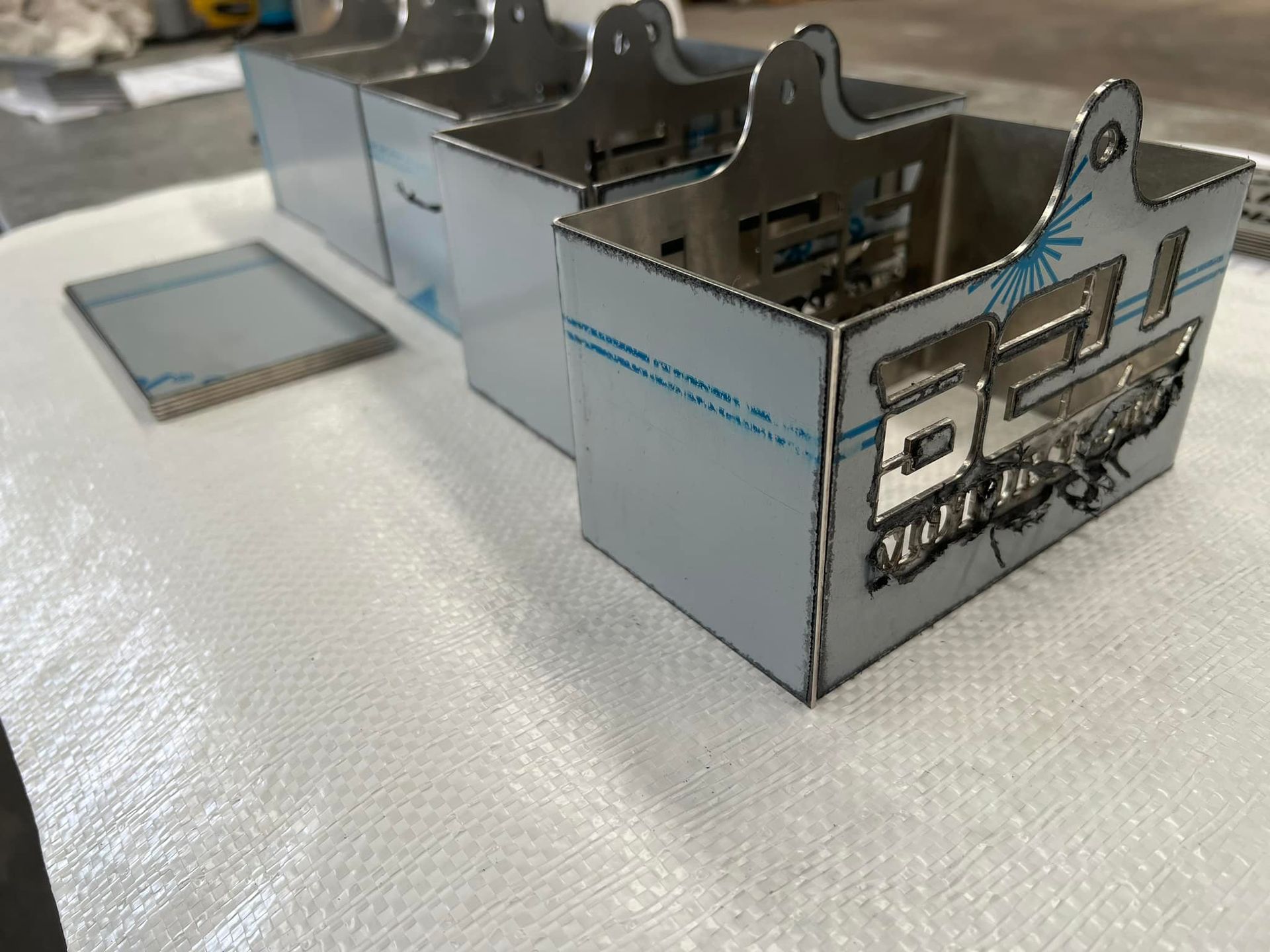 A Stainless Steel Container With A Logo On It Is Sitting On A Table – Wacol, QLD - Morgan Metal Corp