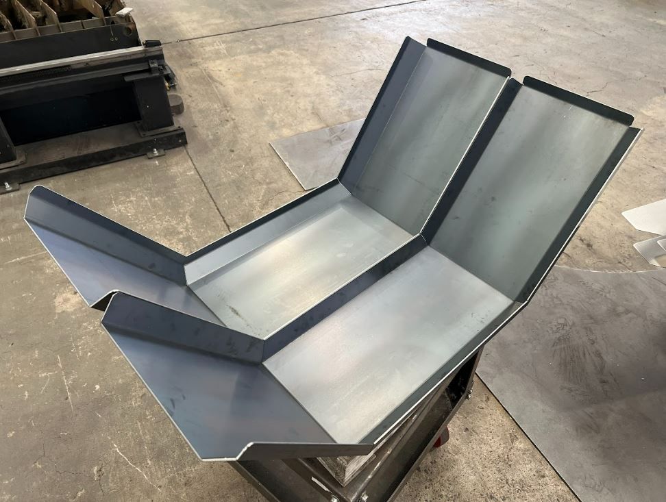 A piece of metal is sitting on top of a table.