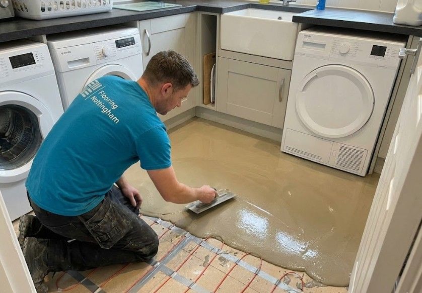 Flooring Nottingham levelling screed over electric underfloor heating wires in a kitchen