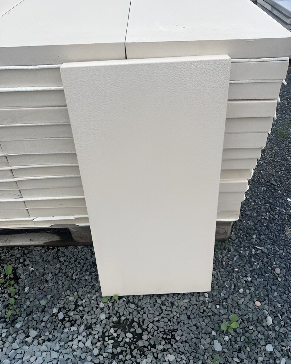 A White Tile is Sitting on Top of a Pile of Tiles — Manning Valley Landscapes in Wingham, NSW