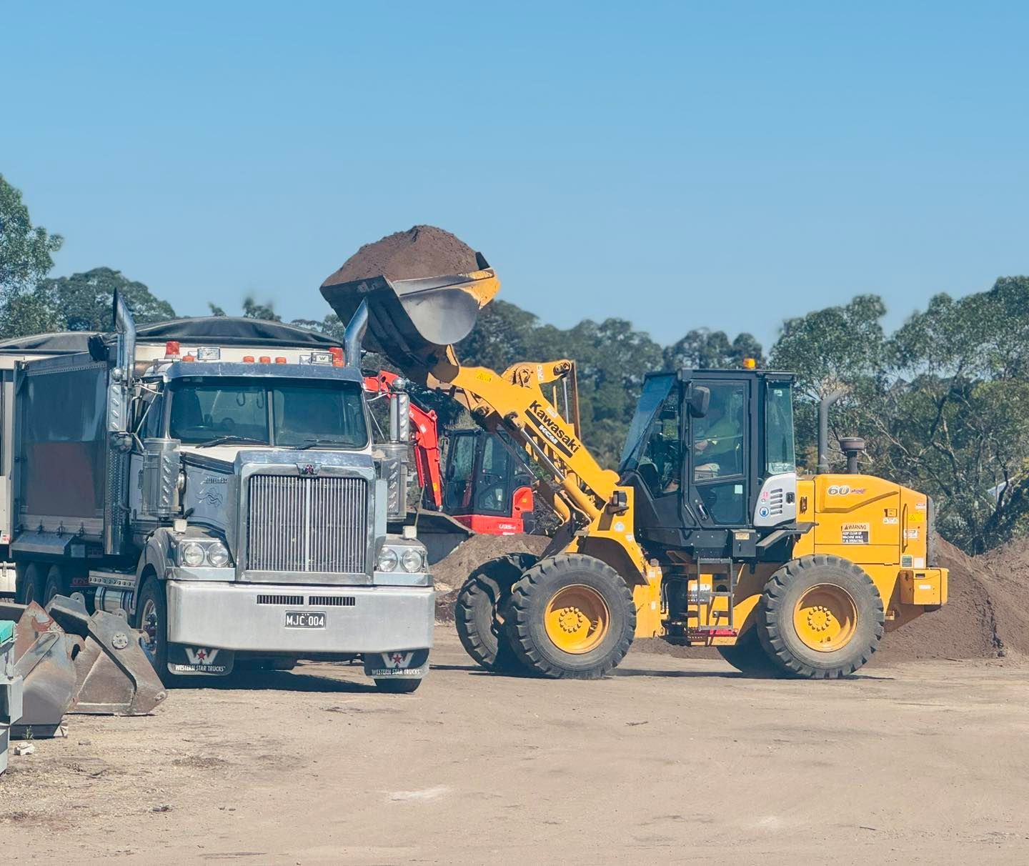 A truck and digger — Manning Valley Landscapes in Wingham, NSW
