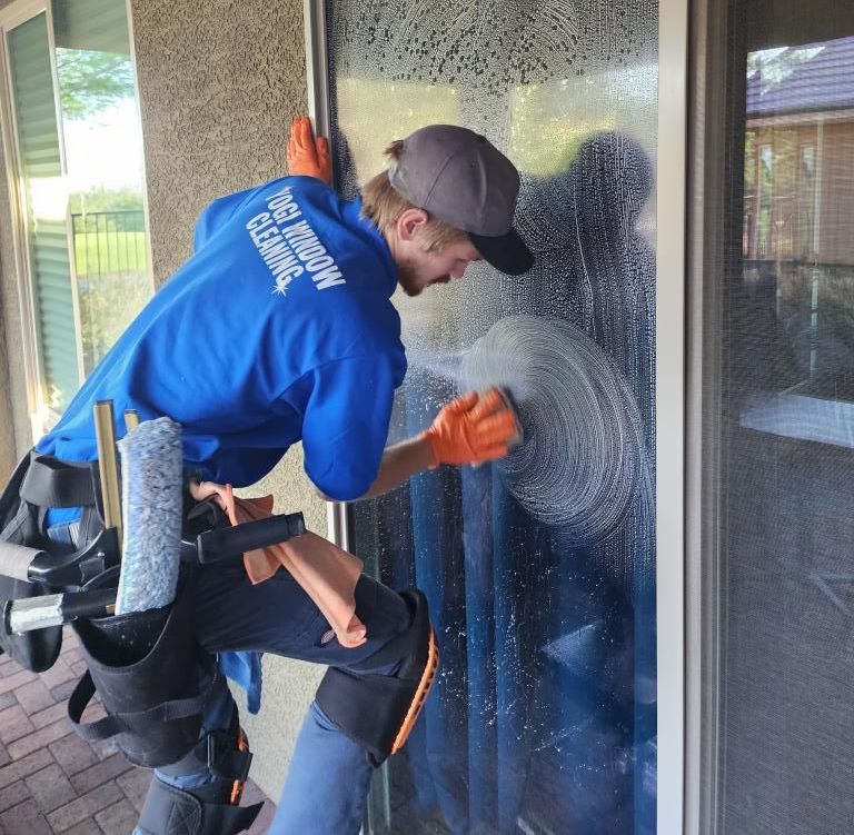 A man wearing a blue shirt with the word cleaning on it