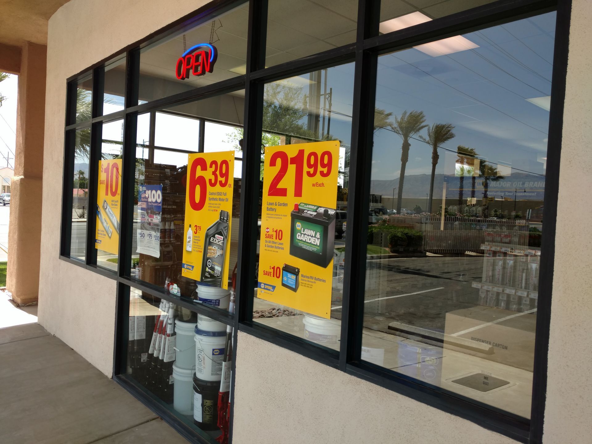 A store front with a sign that says ' 6.99 21.99 ' on it