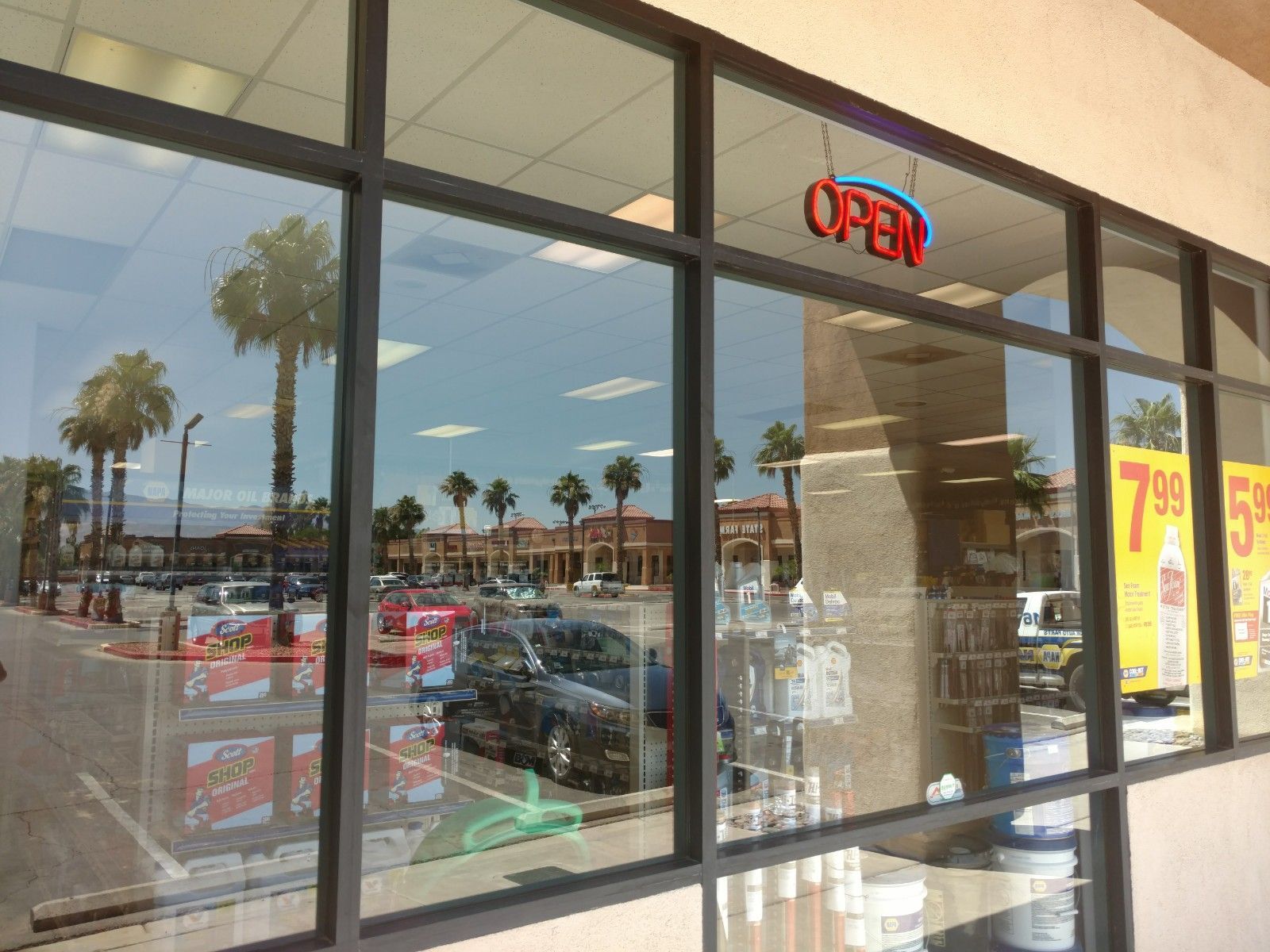 A store front with a sign that says open on it