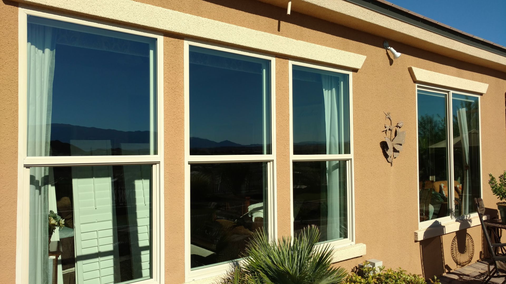 A house with a lot of windows on the side of it