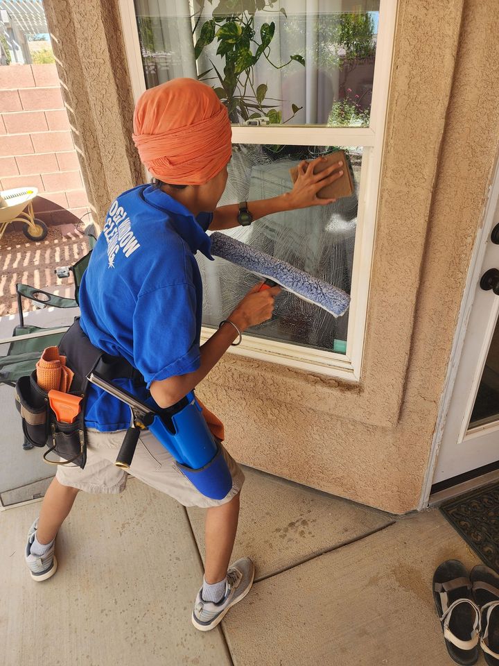 A man wearing a blue shirt with the word cleaning on it