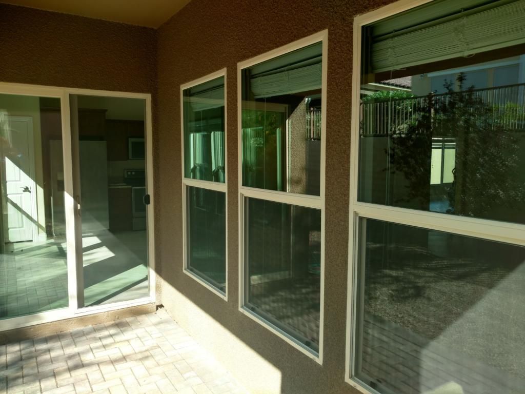 A house with a lot of windows and sliding glass doors