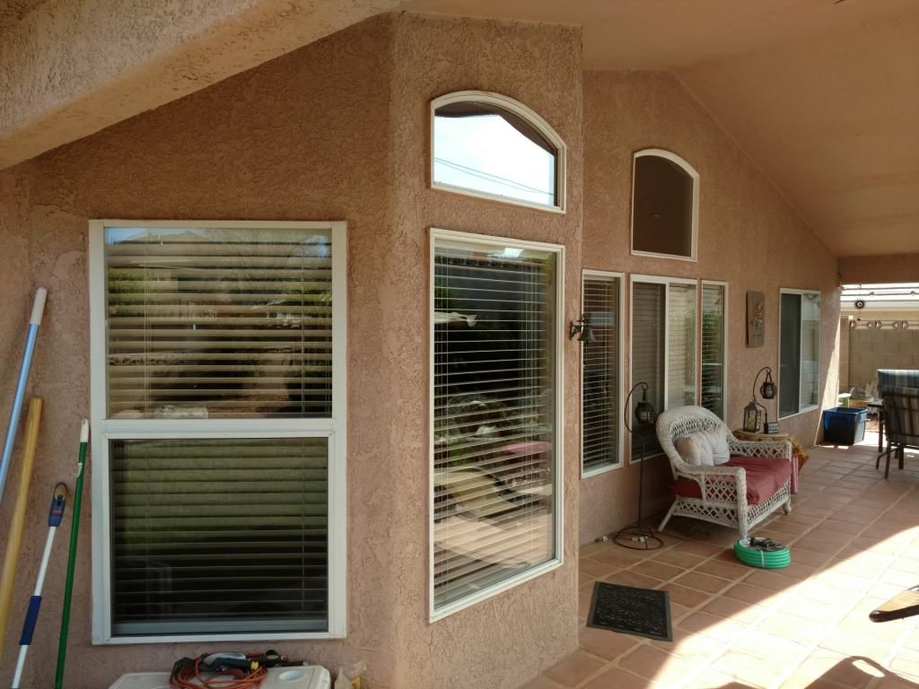 A house with a lot of windows and blinds on it