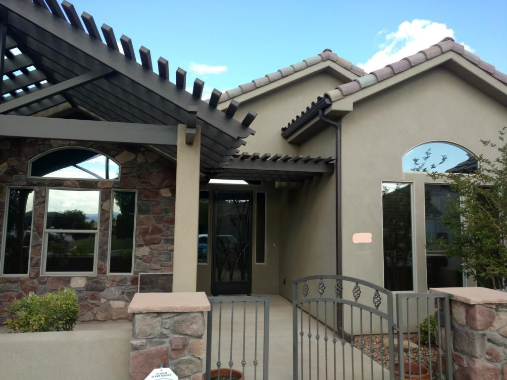 A house with a fence in front of it