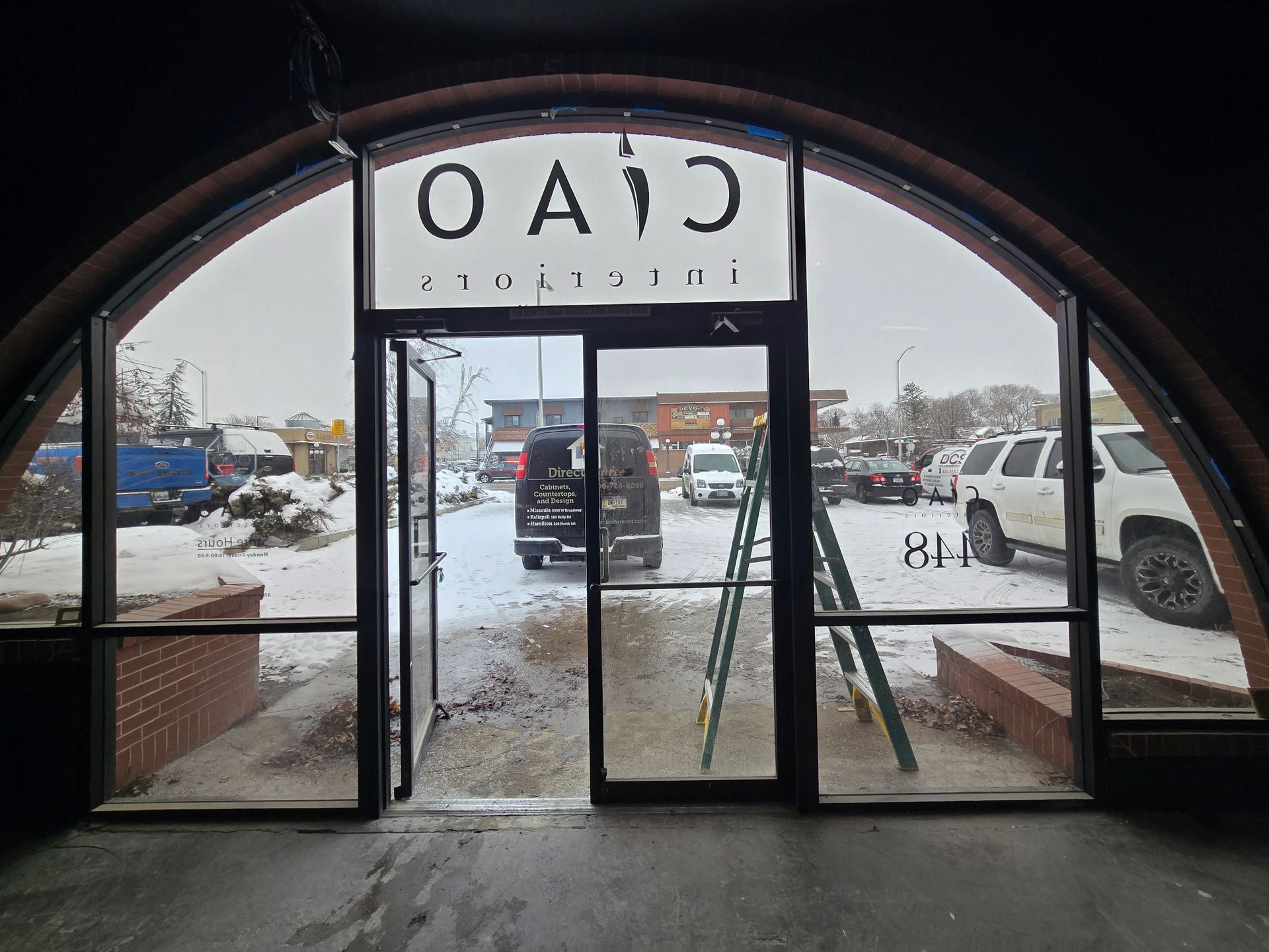 View through a glass storefront labeled 